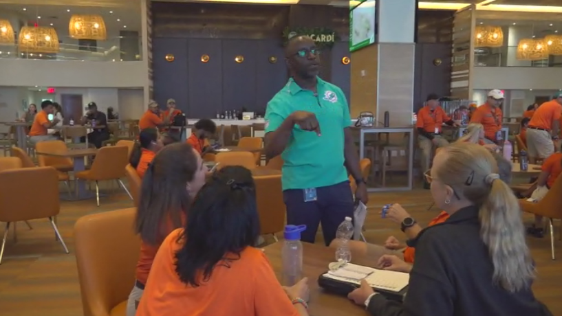 Miami Dade College professor finds his passion with side job at Hard Rock Stadium — CBS Miami, Wellington Arts news